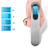 A hand holds a silver portable digital luggage scale displaying various weight measurements like lb, g, oz, and kg.