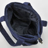 A dark blue canvas shoulder bag with a zipper, shown open and folded.