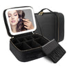 Black LED lighted makeup train case with adjustable dividers and a makeup brush inside