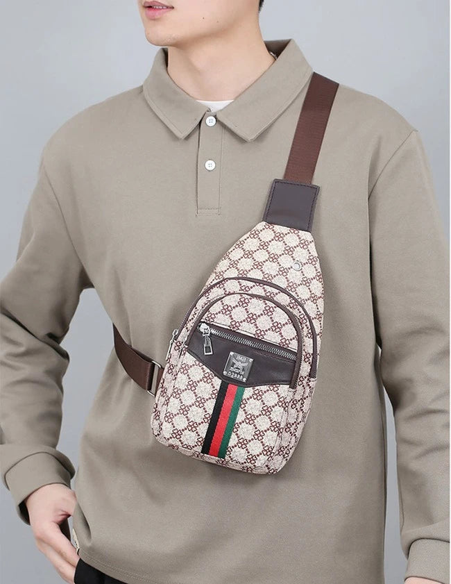 A man wearing a beige long-sleeved shirt with a brown crossbody sling bag attached to his chest.