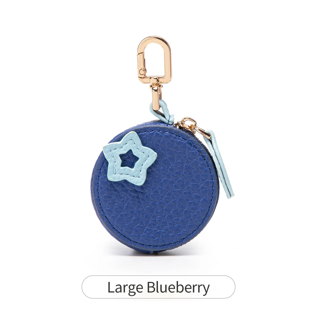 A large blue fabric coin purse with a star detail and a gold-toned keychain.