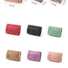 A collection of portable detachable makeup bags in various colors including pink, red, black, green, and purple.
