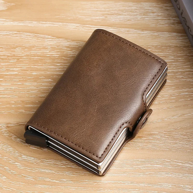 A brown leather double layer ID card holder wallet resting on a light wooden surface.