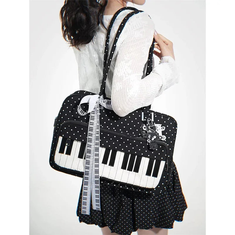A woman is holding a black and white musical note embroidery crossbody bag with a piano print.