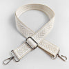 A beige woven strap with an arrow jacquard pattern, featuring metal hardware for a handbag.