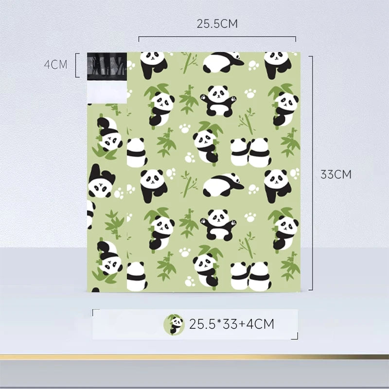 Feuille de papier vert clair avec un motif répétitif de visages de pandas en noir et blanc.