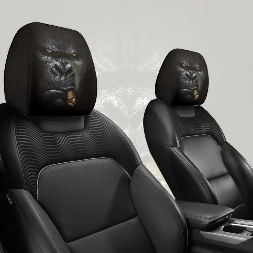A pair of black silicone car headrest covers shown in a vehicle seat interior.