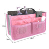 A pink multi-pocket organizer tote bag for cosmetics and essentials with various compartments.