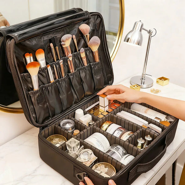 A black large capacity makeup bag is open, displaying various cosmetic tools and skincare products on a white surface.