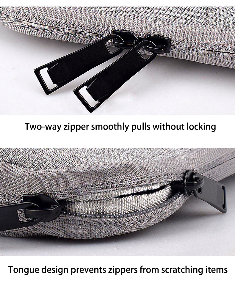 Close-up of a silver fabric laptop sleeve featuring two-way zippers and a tongue design for protection.