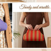 A woman models a brown coat and a striped knit clutch bag, showcasing trendy and versatile fashion.