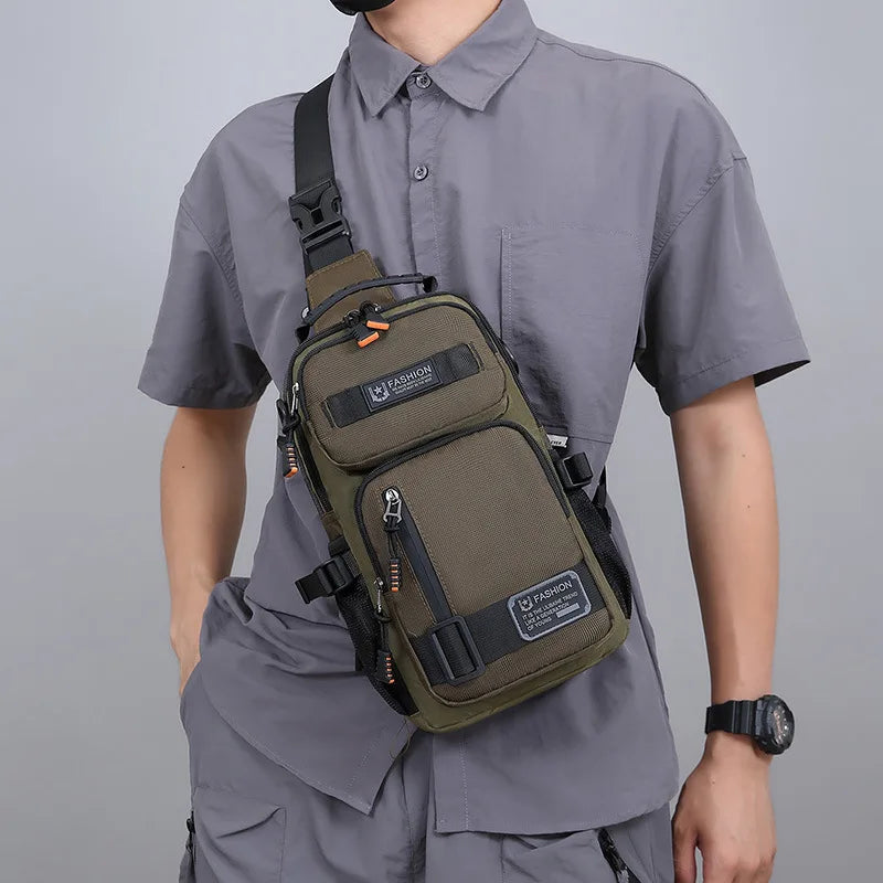 A man wearing a gray shirt carries a olive green multifunctional chest bag on his chest.