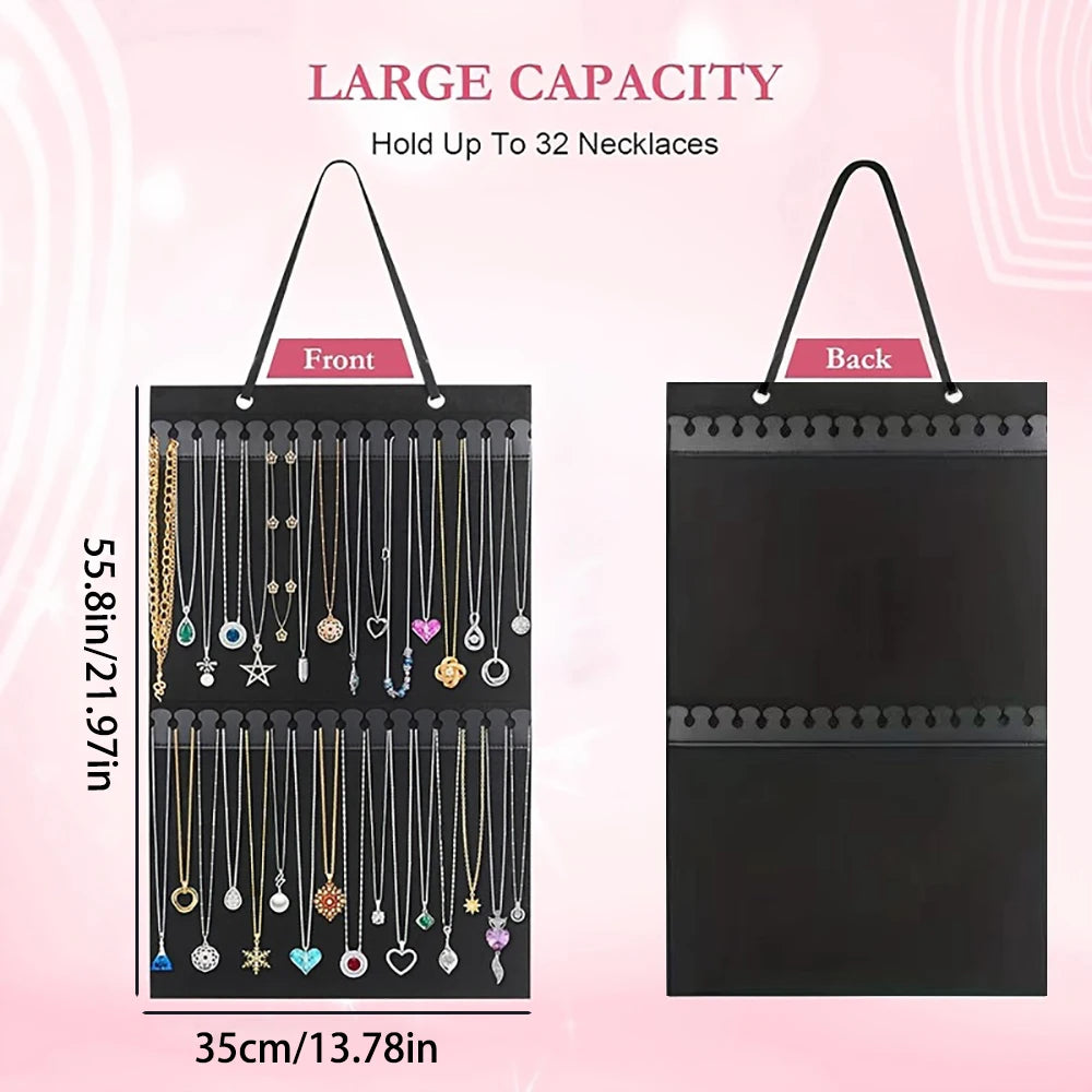 Black fabric jewelry organizer bag with multiple strands of necklaces for wall mounting