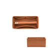 A rectangular felt cloth bag organizer with a fitted interior for storing small items.