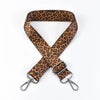 A brown leopard print adjustable crossbody strap for bags.