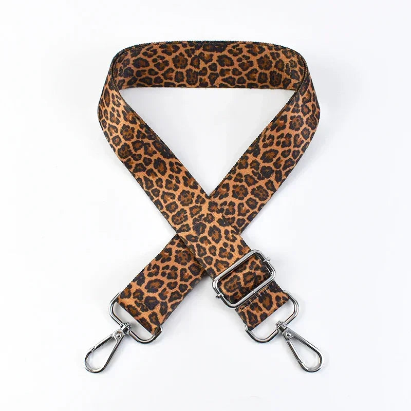 A brown leopard print adjustable crossbody strap for bags.