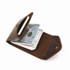 A brown genuine cowhide leather wallet with a flap open showing a stack of US hundred dollar bills.