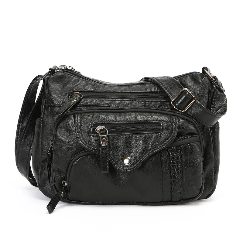 A black luxury leather tote bag with silver hardware and a flap closure.