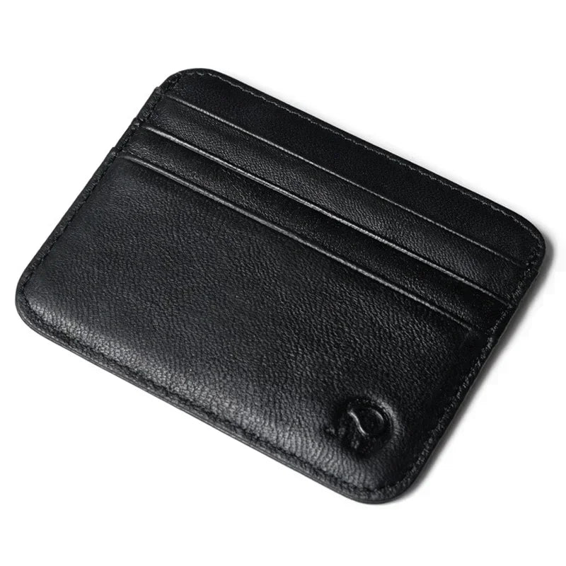 A black genuine leather slim card holder wallet shown from above.