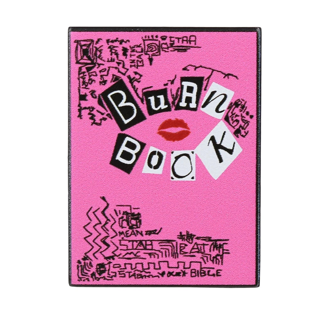دبوس من الإنميل وردي يحمل عبارة Buang Book بخط أسود وتصميم شفاه أحمر.