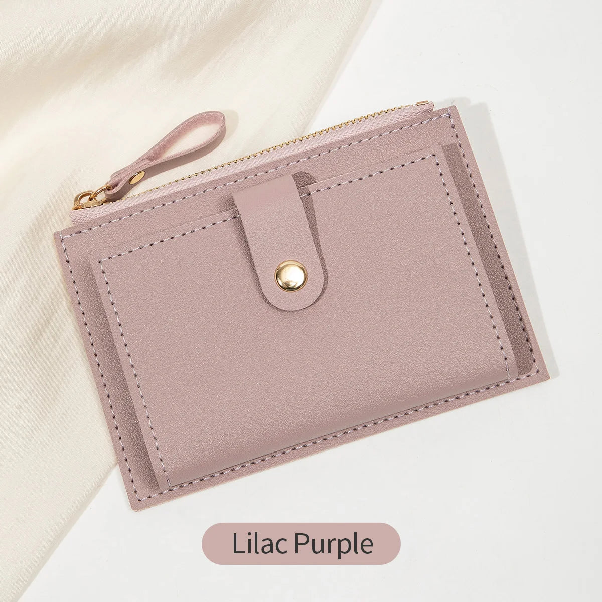 A light lilac purple ultra-thin PU leather card holder wallet with a zipper closure and a leather strap.