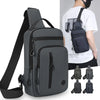 A dark gray lightweight chest bag with a strap and a zippered phone pocket is shown next to a person wearing a white shirt.