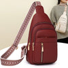 A maroon PU leather crossbody chest bag with a patterned strap is shown against a light background.