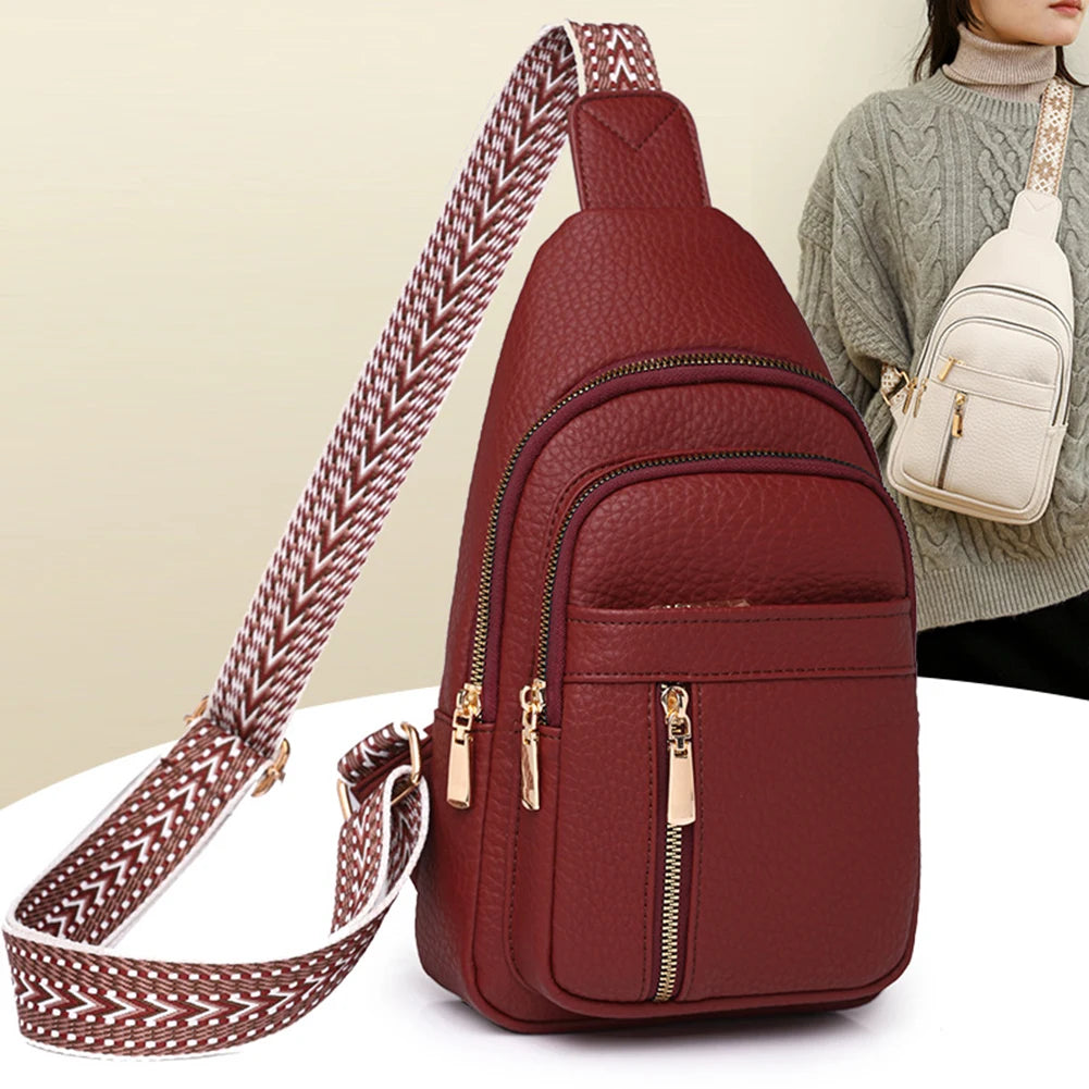 A maroon PU leather crossbody chest bag with a patterned strap is shown against a light background.