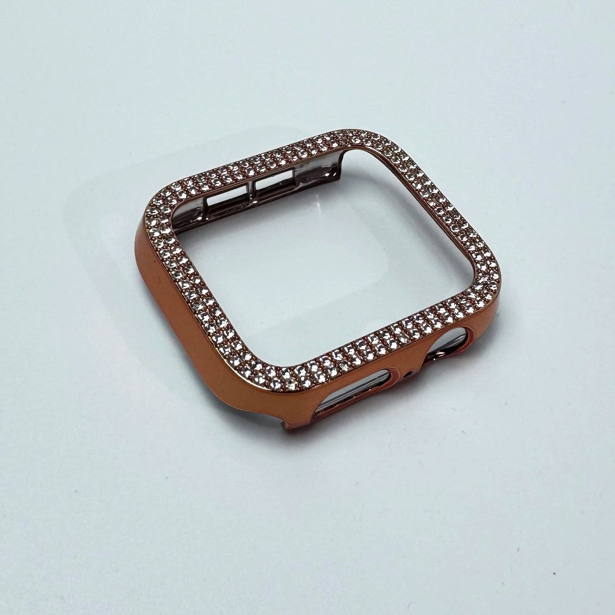 A rose gold glitter diamond rhinestone bumper case for an Apple Watch.