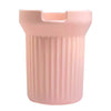 A pink silicone boot sleeve designed to fit water bottles.