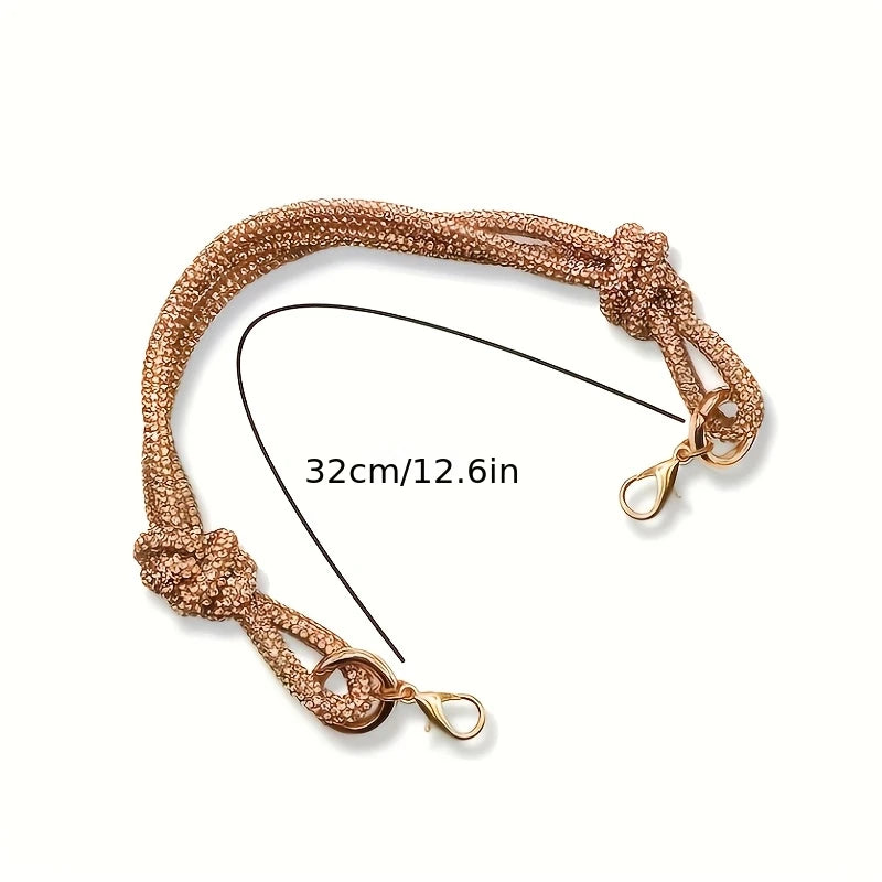 Gold crystal rhinestone handbag chain strap featuring knot details