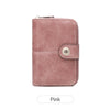 A pink leather wallet with a flap closure and silver zipper.