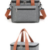 Bolsa térmica gris para picnic con correas marrones y cierres plateados.