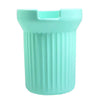 A light mint green silicone boot sleeve designed to fit around a water bottle.
