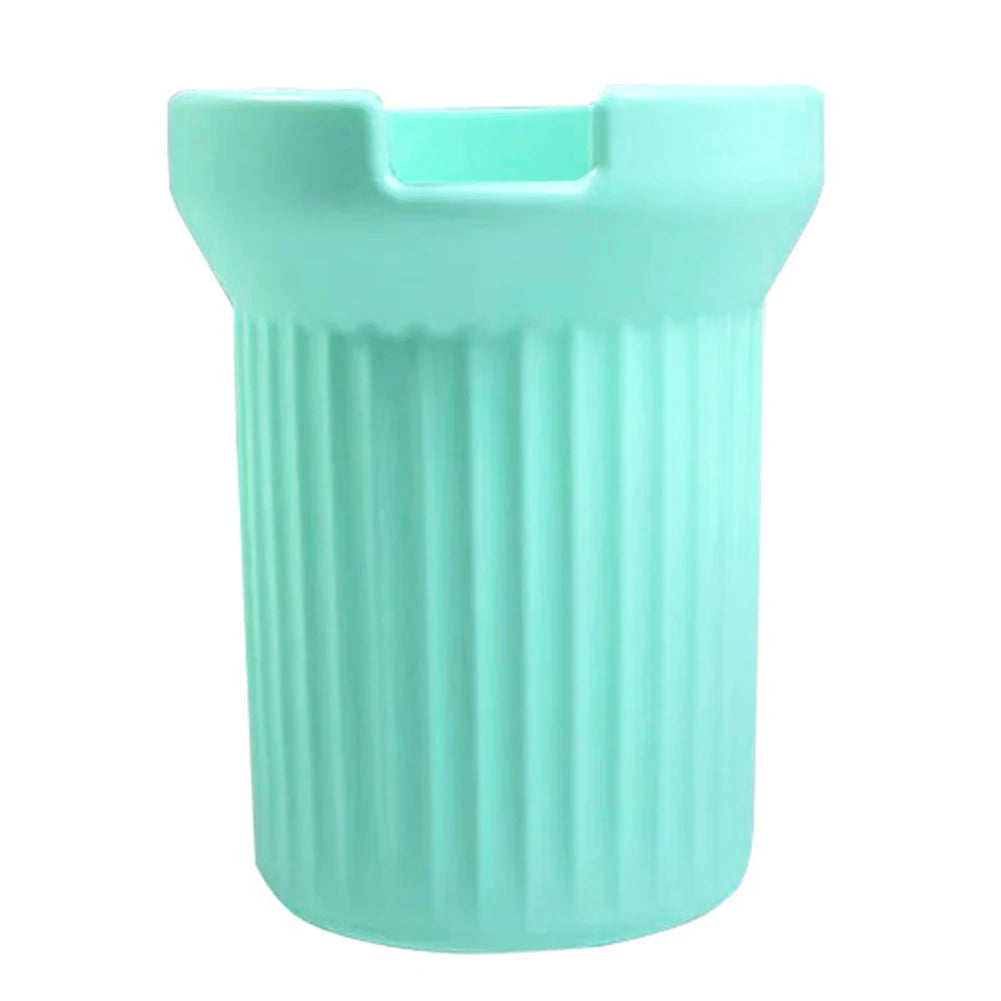 A light mint green silicone boot sleeve designed to fit around a water bottle.