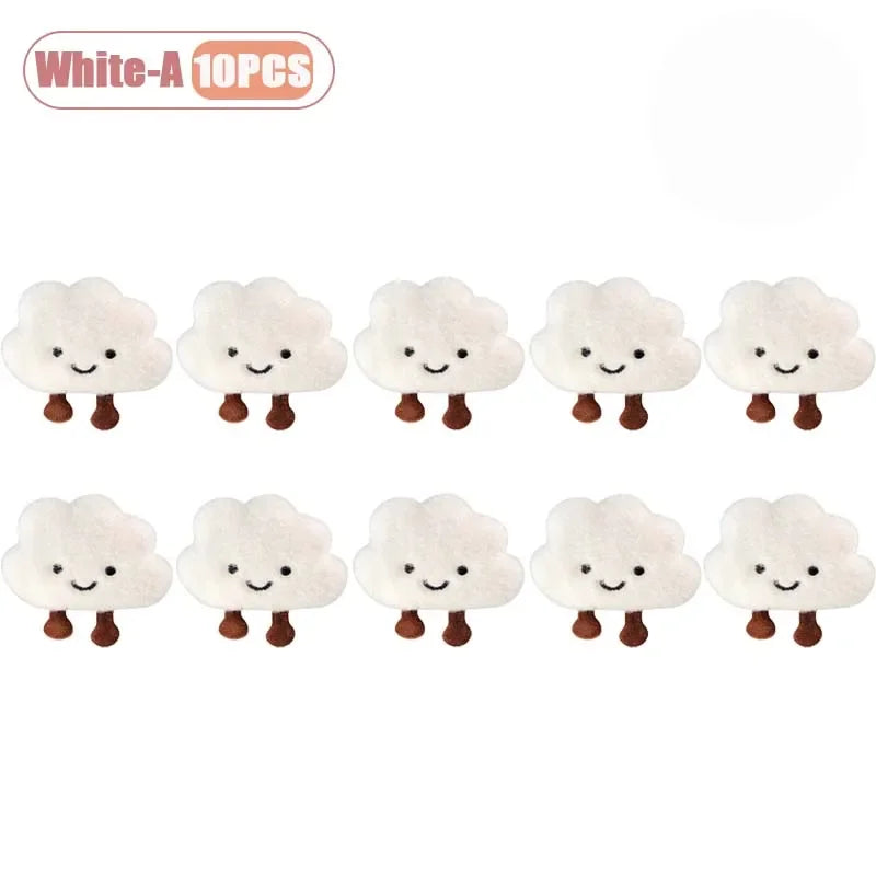 Ten white cloud-shaped plush keychains and brooch pins