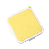 Yellow silicone reusable sandwich and lunch container with a white seal.