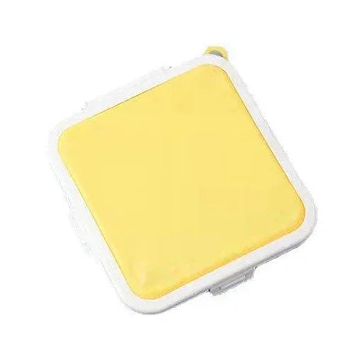Yellow silicone reusable sandwich and lunch container with a white seal.