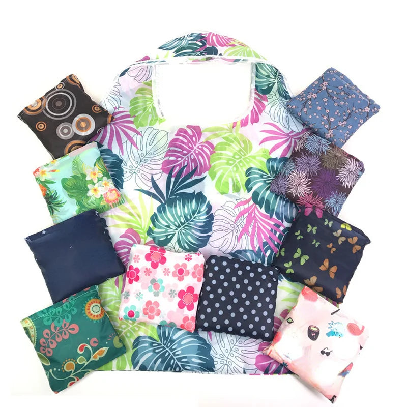 A colorful foldable flower print tote bag featuring various floral patterns and colors.