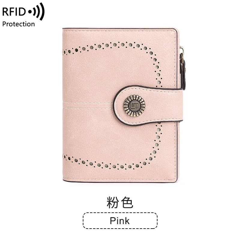 A pink multi-fold RFID protection wallet with decorative stitching and a gold-colored accent.