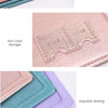 Pink and purple RFID blocking PU leather passport holders stacked and displayed with close-ups of stitching