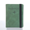 A dark green passport organizer wallet with a black strap and a stylized airplane icon.