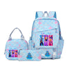 A light blue and pink multi-compartment casual backpack featuring a repeating scale pattern and colorful character designs.