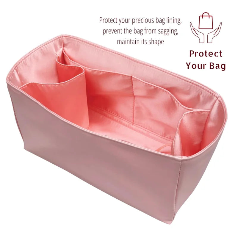A pink luxury bag organizer insert with silk lining designed to protect and maintain the shape of a bag.
