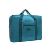 A teal foldable travel duffel bag with a luggage strap and carrying handles.
