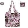 A reusable eco tote shopping bag featuring a collage of magazine and newspaper clippings.