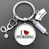 Silver keychain featuring a stethoscope charm and a circular pendant with the text I NURSING