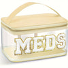 Clear toiletry bag with a lid featuring the word MEDS embroidered in gold thread