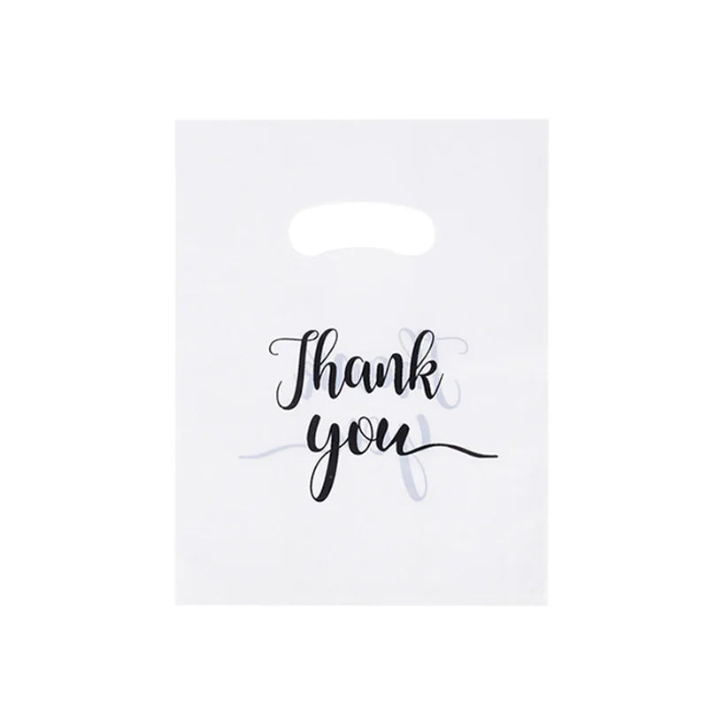A white card with the handwritten text Thank you you in black script.