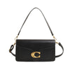 A black leather shoulder bag with gold hardware and a long strap.